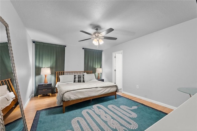 704 Del Cir, Lowell, AR 72745 - bedroom with wood finished floors, baseboards, and a ceiling fan
