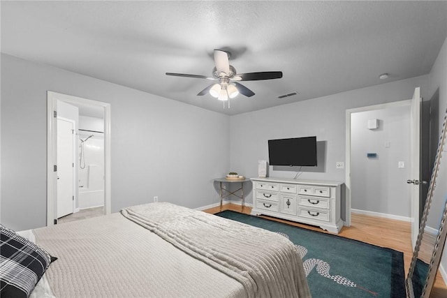 704 Del Cir, Lowell, AR 72745 - bedroom with baseboards, ceiling fan, and wood finished floors