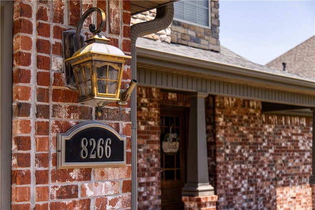 8266 Anna Maria Ave, Springdale, AR 72762 - view of exterior entry with brick siding and a shingled roof