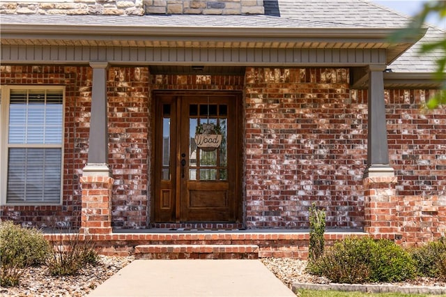 8266 Anna Maria Ave, Springdale, AR 72762 - property entrance featuring brick siding, a shingled roof, and a porch