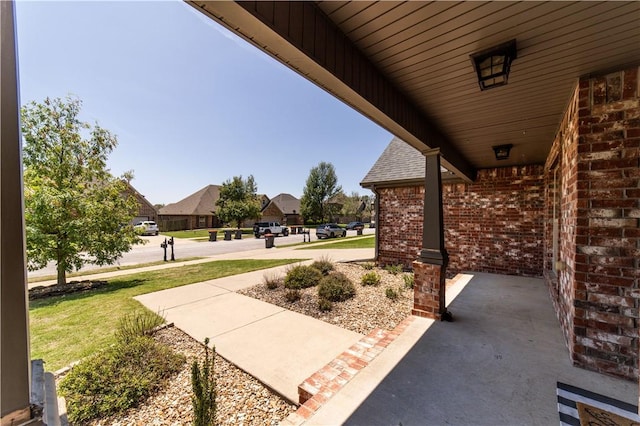 8266 Anna Maria Ave, Springdale, AR 72762 - covered porch with a yard and a residential view
