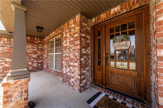 8266 Anna Maria Ave, Springdale, AR 72762 - doorway to property featuring brick siding and a porch