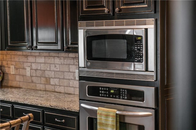 8266 Anna Maria Ave, Springdale, AR 72762 - kitchen with stainless steel appliances, tasteful backsplash, and light stone countertops