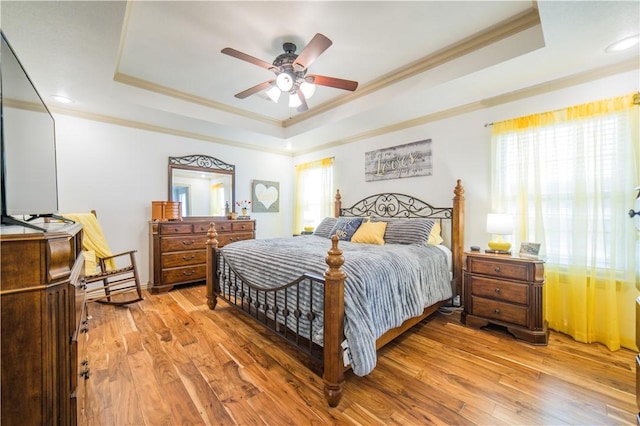 8266 Anna Maria Ave, Springdale, AR 72762 - bedroom featuring a tray ceiling, ornamental molding, light wood finished floors, recessed lighting, and a ceiling fan