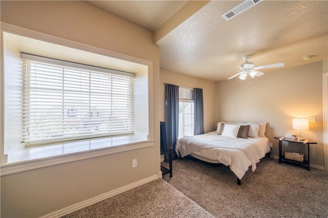8266 Anna Maria Ave, Springdale, AR 72762 - carpeted bedroom with baseboards, a textured ceiling, and ceiling fan