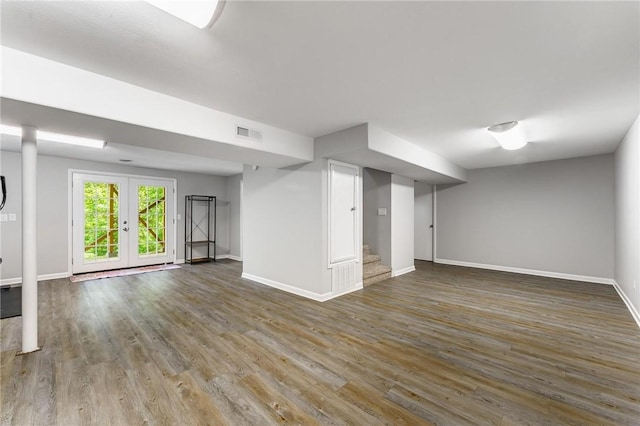 21 Chudleigh Ln, Bella Vista, AR 72714 - below grade area with baseboards, wood finished floors, stairway, and french doors