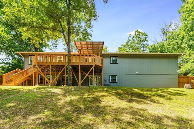 21 Chudleigh Ln, Bella Vista, AR 72714 - back of house featuring a wooden deck, a yard, and stairway