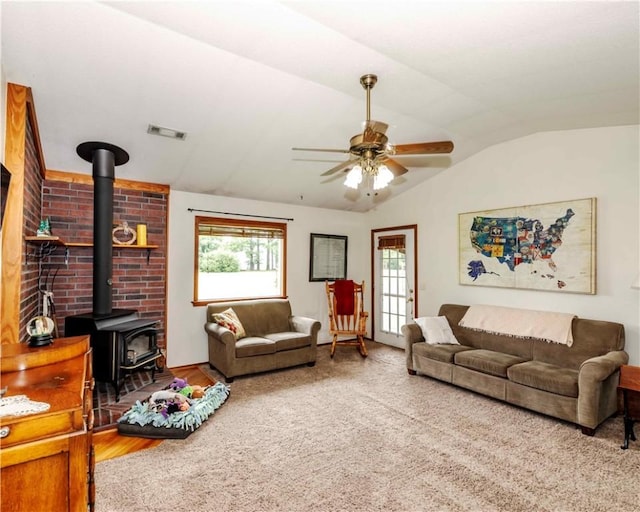 518 W Aster Ave, Farmington, AR 72730 - living area with a wood stove, vaulted ceiling, a ceiling fan, and wood finished floors