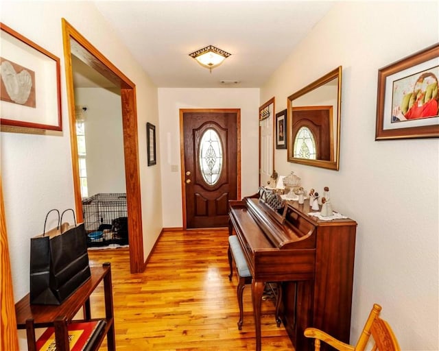518 W Aster Ave, Farmington, AR 72730 - foyer entrance with light wood-type flooring, plenty of natural light, and baseboards