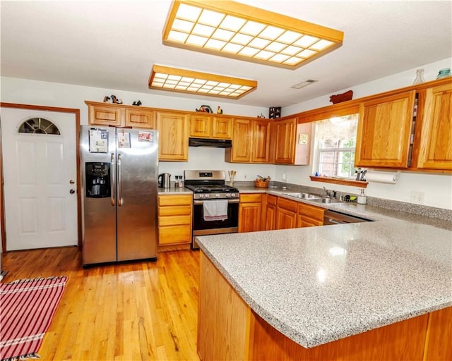 518 W Aster Ave, Farmington, AR 72730 - kitchen with appliances with stainless steel finishes, a sink, brown cabinetry, and under cabinet range hood