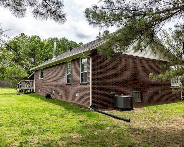 518 W Aster Ave, Farmington, AR 72730 - view of side of property with central air condition unit, brick siding, a yard, and a deck