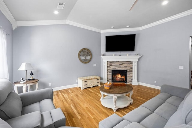6645 Valley View Rd, Rogers, AR 72758 - living room featuring crown molding, light wood-style floors, baseboards, recessed lighting, and a fireplace