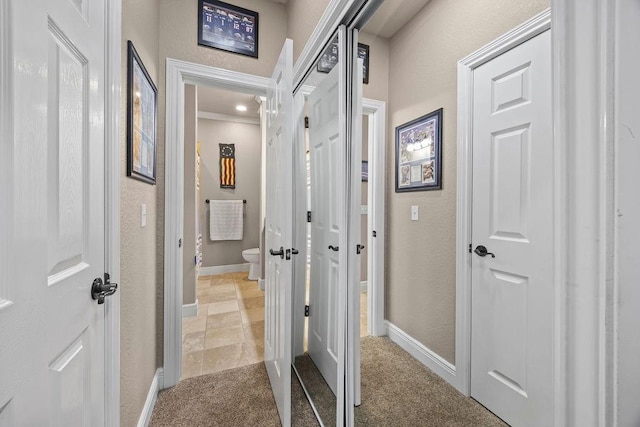 6645 Valley View Rd, Rogers, AR 72758 - corridor with a textured wall, baseboards, and carpet flooring