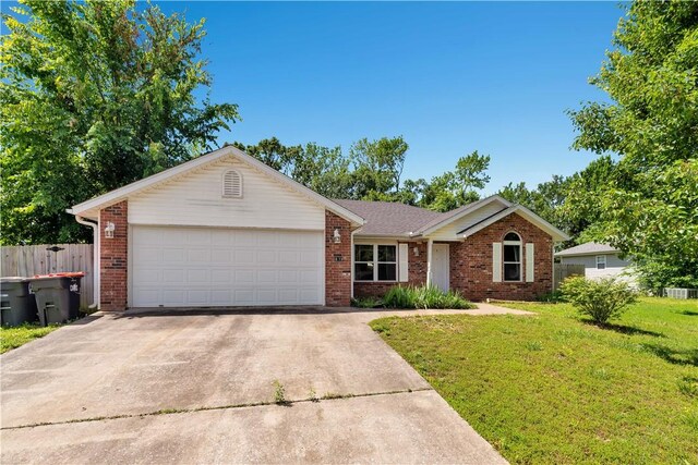 679 Richland Creek Ave, Elkins, AR 72727 - ranch-style home with brick siding, driveway, and an attached garage