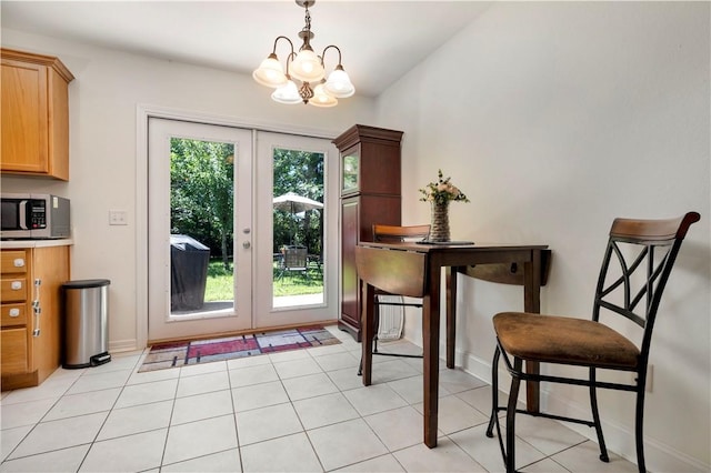 679 Richland Creek Ave, Elkins, AR 72727 - dining room featuring french doors, a chandelier, and baseboards