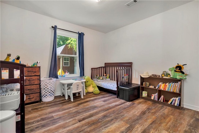679 Richland Creek Ave, Elkins, AR 72727 - bedroom featuring wood finished floors and baseboards