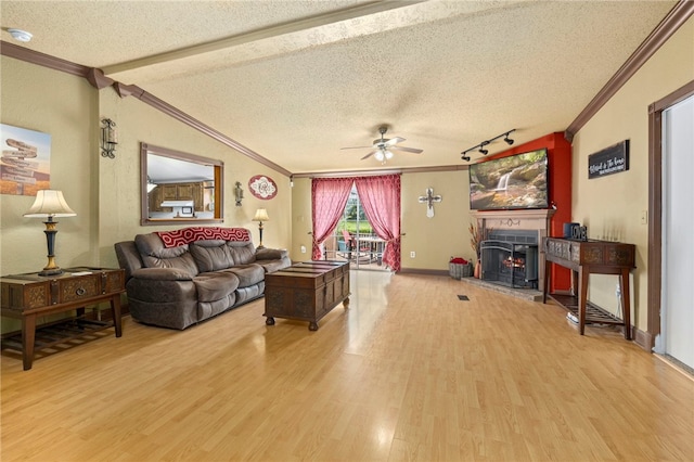 18246 Oakridge Rd, Springdale, AR 72764 - living room with ornamental molding, a textured ceiling, light wood-type flooring, and a ceiling fan