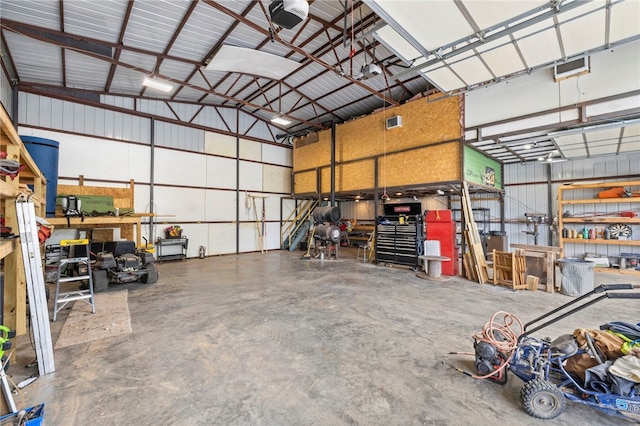 18246 Oakridge Rd, Springdale, AR 72764 - garage featuring metal wall and a garage door opener