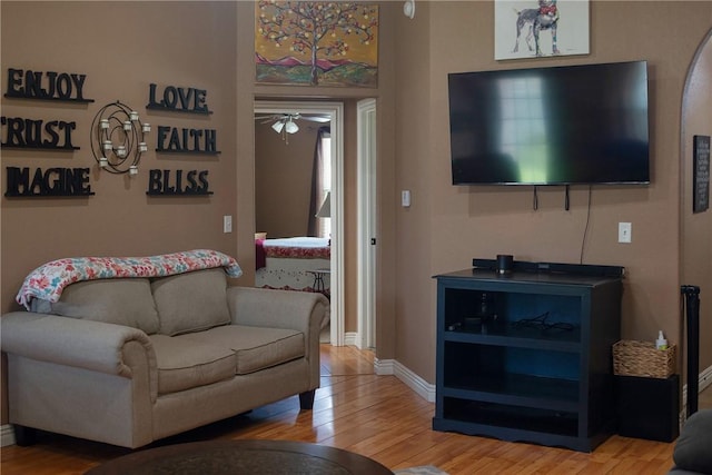 609 Buffalo Ln, Springdale, AR 72764 - living room featuring wood finished floors, a ceiling fan, and baseboards