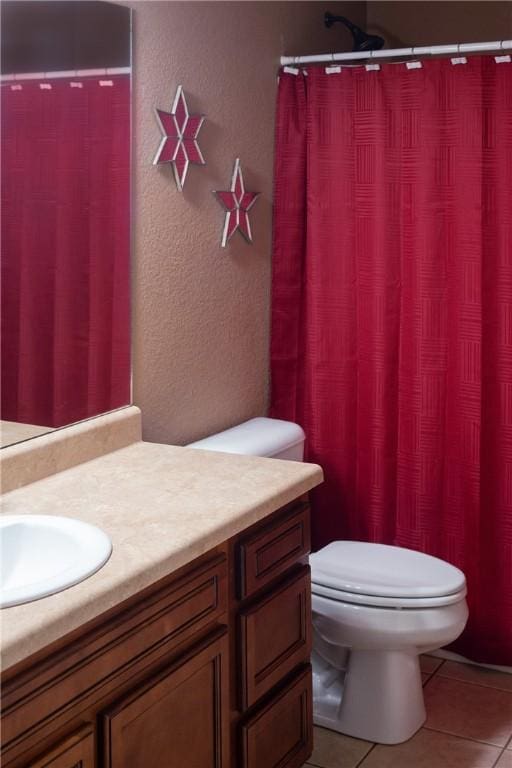 609 Buffalo Ln, Springdale, AR 72764 - bathroom with vanity, toilet, a textured wall, tile patterned floors, and a shower with curtain