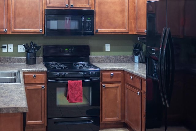 609 Buffalo Ln, Springdale, AR 72764 - kitchen with black appliances, brown cabinets, and light countertops