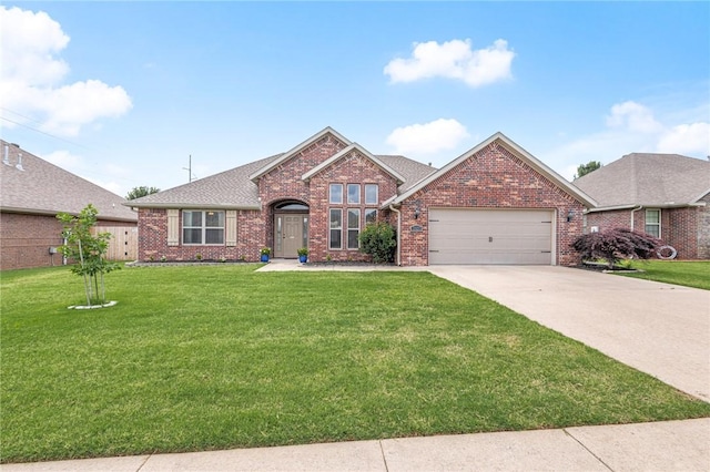 1021 Harvest St, Centerton, AR 72719 - view of front facade with brick siding, a garage, a front lawn, and driveway