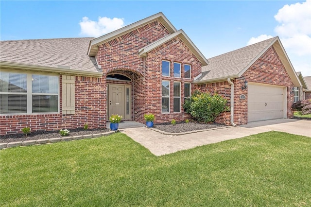 1021 Harvest St, Centerton, AR 72719 - traditional home featuring brick siding, an attached garage, a front yard, and a shingled roof