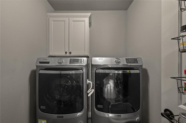 1021 Harvest St, Centerton, AR 72719 - laundry area with washing machine and clothes dryer and cabinet space