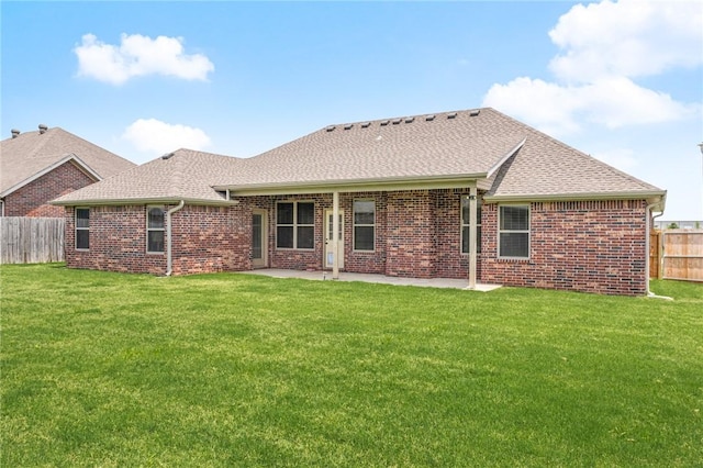 1021 Harvest St, Centerton, AR 72719 - back of house with brick siding, a patio area, and roof with shingles