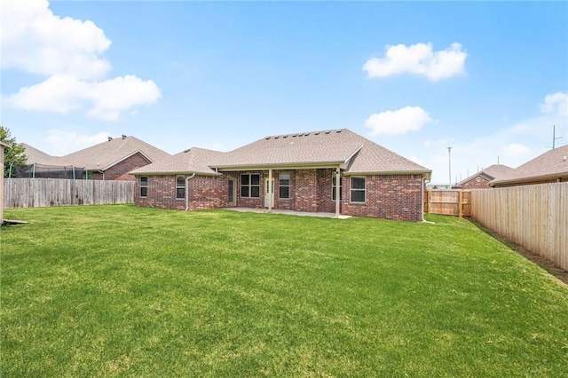 1021 Harvest St, Centerton, AR 72719 - back of house with brick siding and a patio area