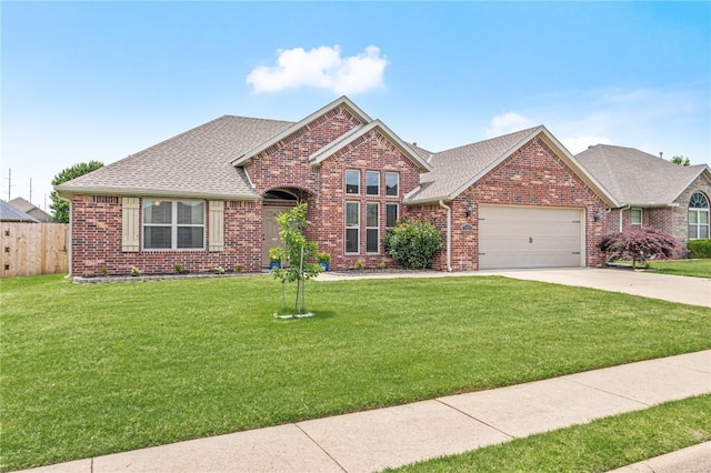 1021 Harvest St, Centerton, AR 72719 - view of front of home with brick siding, a garage, driveway, and a shingled roof