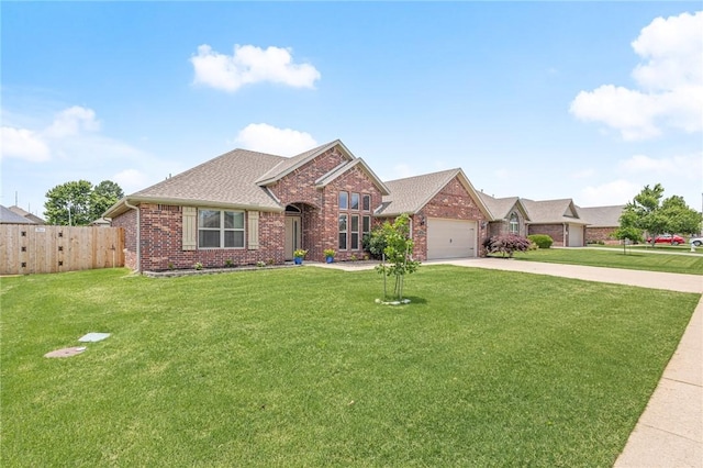 1021 Harvest St, Centerton, AR 72719 - view of front of house with brick siding, driveway, an attached garage, and a shingled roof