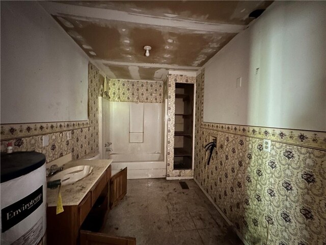 13888 White Oak Ln, Bentonville, AR 72712 - bathroom featuring water heater, a wainscoted wall, vanity, and tile walls