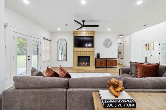 204 NE Healing Springs St, Bentonville, AR 72713 - living area with french doors, ceiling fan, recessed lighting, light wood-type flooring, and baseboards