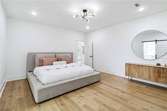 204 NE Healing Springs St, Bentonville, AR 72713 - bedroom with a chandelier, wood finished floors, baseboards, and recessed lighting