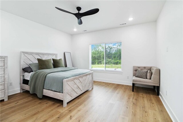 204 NE Healing Springs St, Bentonville, AR 72713 - bedroom with light wood-type flooring, baseboards, ceiling fan, and recessed lighting