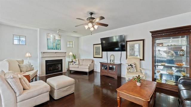2111 Hunter Dr, Pea Ridge, AR 72751 - living room featuring ceiling fan, a fireplace, and dark wood-type flooring