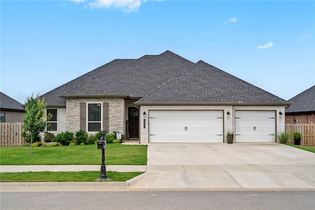 2009 Abbott Ln, Pea Ridge, AR 72751 - view of front facade featuring driveway, a garage, roof with shingles, and brick siding