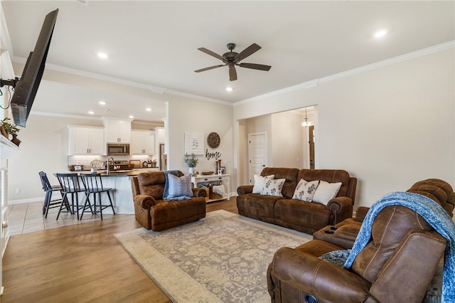 2009 Abbott Ln, Pea Ridge, AR 72751 - living area featuring ceiling fan, recessed lighting, light wood-style floors, and ornamental molding