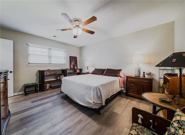 1608 Cartwright Cir, Springdale, AR 72762 - bedroom featuring wood finished floors, ceiling fan, and baseboards