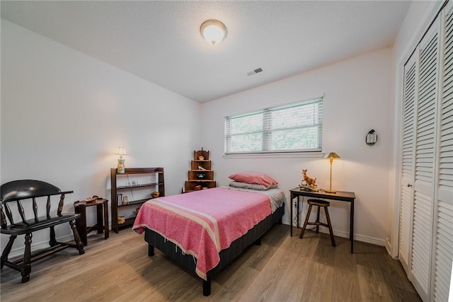 1608 Cartwright Cir, Springdale, AR 72762 - bedroom with wood finished floors, a closet, and baseboards
