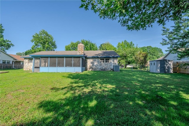 1608 Cartwright Cir, Springdale, AR 72762 - rear view of house featuring stone siding, a sunroom, a chimney, and cooling unit
