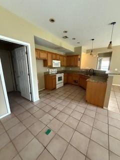 1210 Apache Dr, Bentonville, AR 72712 - kitchen featuring white appliances, a peninsula, light tile patterned flooring, brown cabinets, and decorative light fixtures