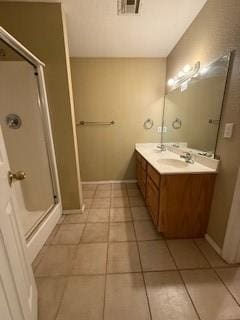 1210 Apache Dr, Bentonville, AR 72712 - full bath featuring a stall shower, tile patterned floors, double vanity, and baseboards