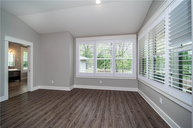 19643 Indigo Dr, Rogers, AR 72756 - spare room featuring lofted ceiling, dark wood finished floors, and baseboards