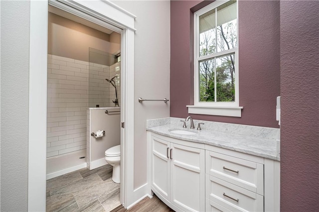 19643 Indigo Dr, Rogers, AR 72756 - full bathroom with toilet, walk in shower, vanity, and baseboards