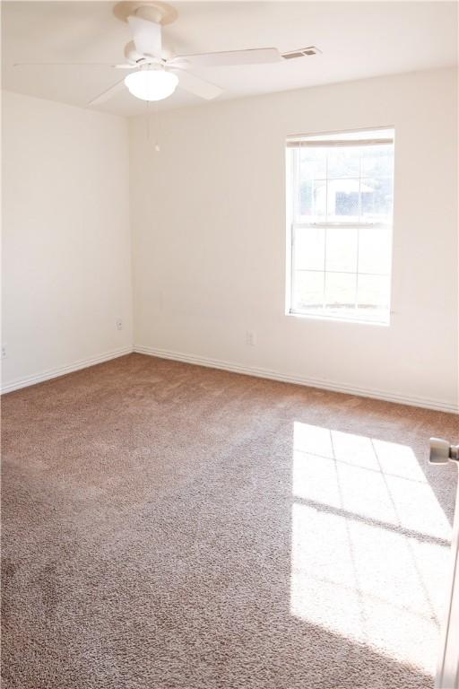 19105 Feather Hill Rd, Elkins, AR 72727 - empty room featuring ceiling fan, carpet flooring, and baseboards