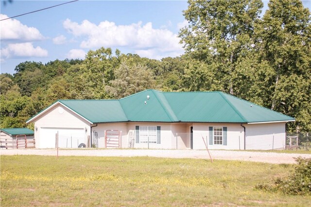 19105 Feather Hill Rd, Elkins, AR 72727 - view of front of home with a garage and metal roof