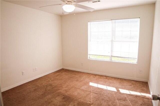 19105 Feather Hill Rd, Elkins, AR 72727 - empty room featuring carpet flooring, a ceiling fan, and baseboards
