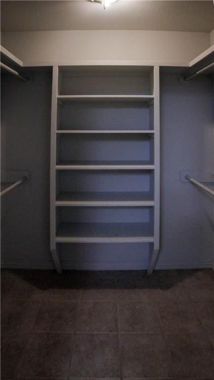 19105 Feather Hill Rd, Elkins, AR 72727 - walk in closet with dark tile patterned floors